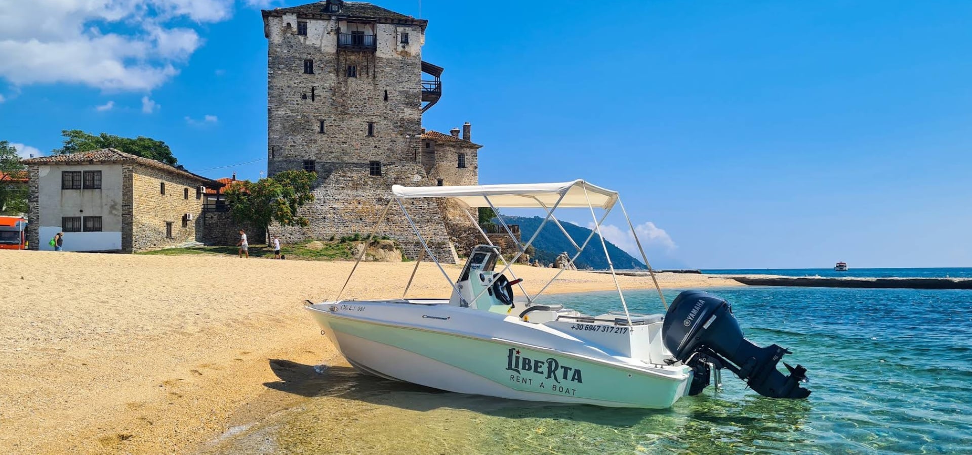 Ouranoupoli coast with a boat available for rent from Liberta Boats